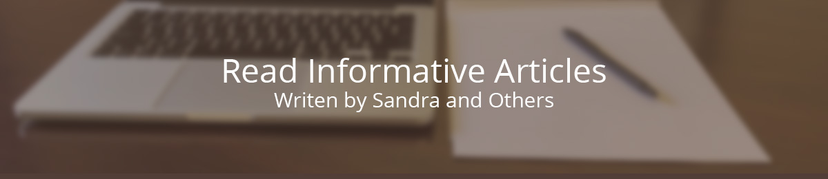 computer and pad of paper to write articles