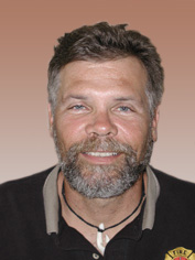 man with beard and smile not smoking